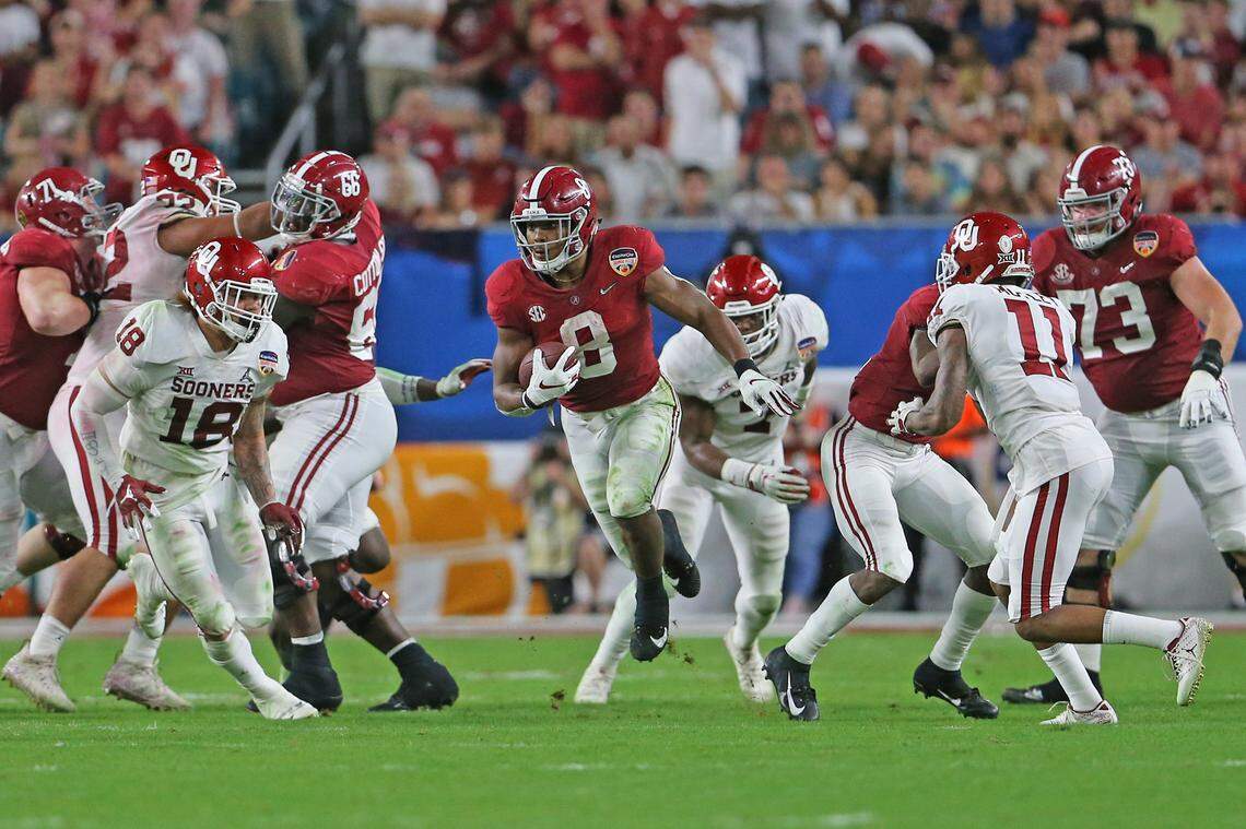 Alabama Crimson Tide running back Josh Jacobs (8) runs during second quarter of the College Football Playoff Semifinal at the Orange Bowl game against the Oklahoma Sooners at Hard Rock Stadium on Saturday, December 29 2018, in Miami Gardens.