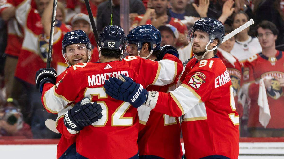 Florida Panthers center Sam Bennett (9) celebrates with his teammates after scoring a goal against the Tampa Bay Lightning in the first period in Game 2 of the first-round of the 2024 Stanley Cup Playoffs at Amerant Bank Arena on Tuesday, April 23, 2024, in Sunrise, Fla.