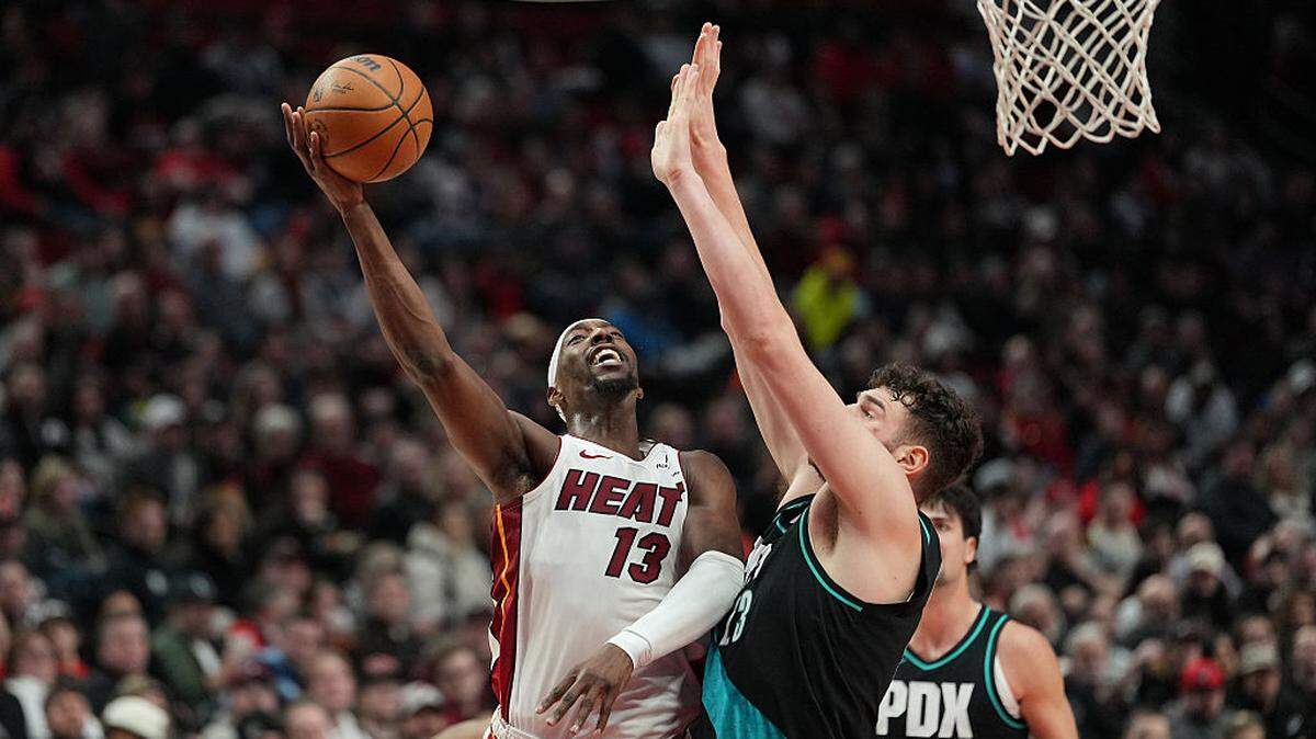 Bam Adebayo #13 of the Miami Heat lays up a shot against Donovan Clingan #23 of the Portland Trail Blazers during the first half at Moda Center on January 22, 2026 in Portland.
