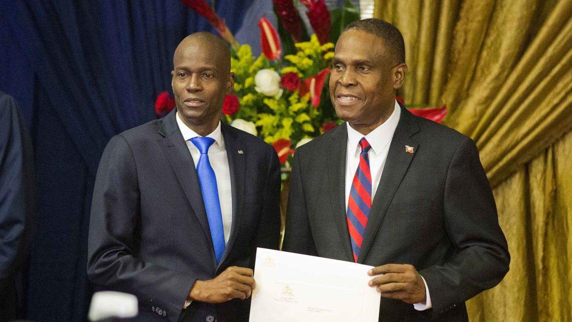 Jean Henry Céant, right, officially became Haiti’s prime minister Sunday after the Lower Chamber of Deputies overwhelmingly voted in favor of his political program. He poses for a picture with Haiti’s President Jovenel Moise as they hold up his appointment document at the National Palace in Port-au-Prince, Haiti, on Tuesday, Aug. 7, 2018.