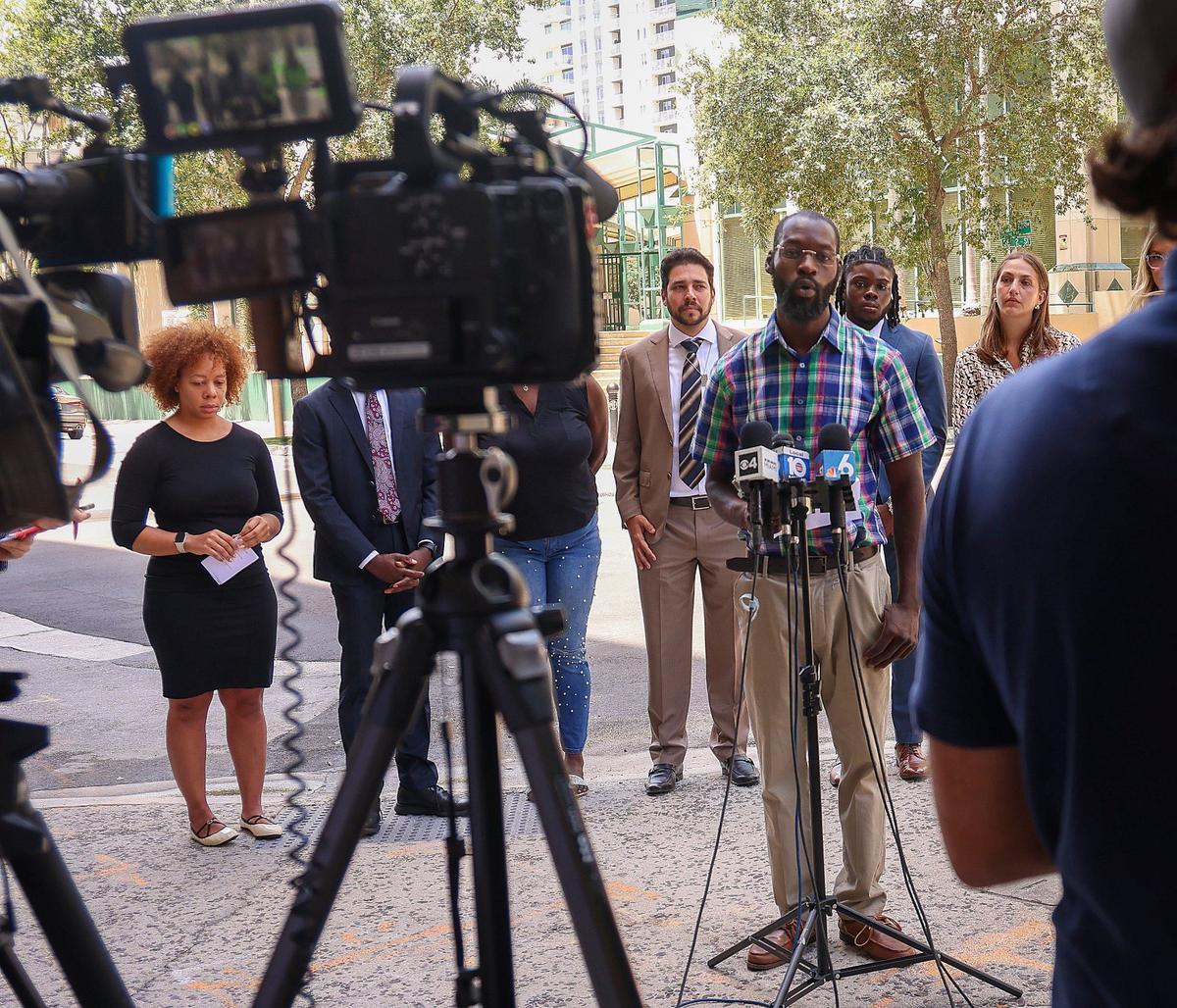 Plaintiff Mike Gabelus, right, speaks during press conference as attorneys announced lawsuit filed by LaToya Ratlieff, left, and others against Fort Lauderdale Police Department for the violent response to peaceful protesters at the May 31, 2020, George Floyd protest on Monday, June 3, 2024, in Fort Lauderdale, Florida.