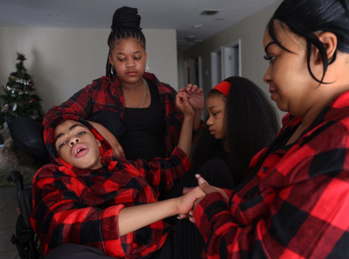 From left: Keshon Smith, 15, America Smith, 12, Najmah Smith, 8, and Kisha Smith, 38.