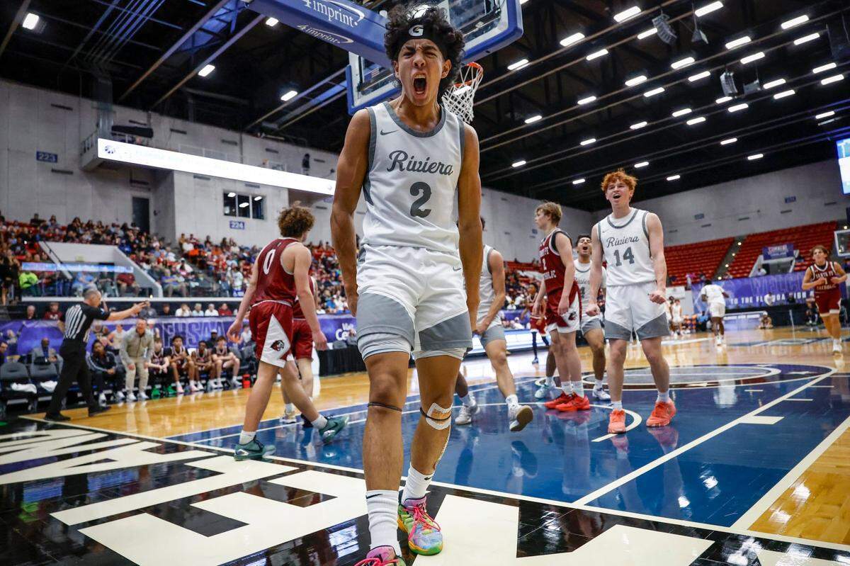 Riviera Prep’s Mason Fuentes (2) reacts after scoring against Santa Fe Catholic in the first half of the FHSAA Class 2A Boys High School Basketball State Championship.