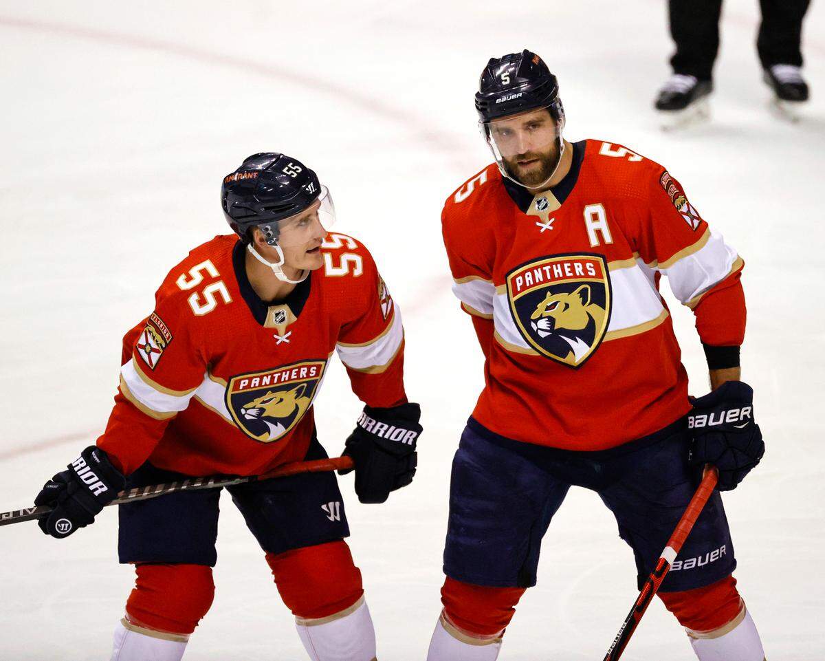 Florida Panthers defenseman Aaron Ekblad (5) talks with teammate Noel Acciari (55) during the first period of an NHL game against the Philadelphia Flyers at the FLA Live Arena on Thursday, March 10, 2022 in Sunrise, Fl.