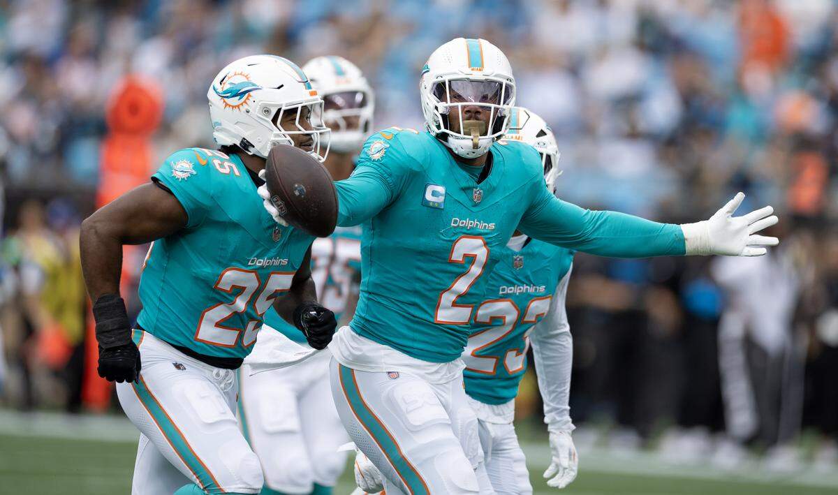 Miami Dolphins outside linebacker Bradley Chubb (2) celebrates with teammates after forcing and recovering a fumble by Carolina Panthers quarterback Bryce Young (9) during the first half of an NFL game Sunday, Oct. 5, 2025, at Bank of America Stadium in Charlotte, N.C.