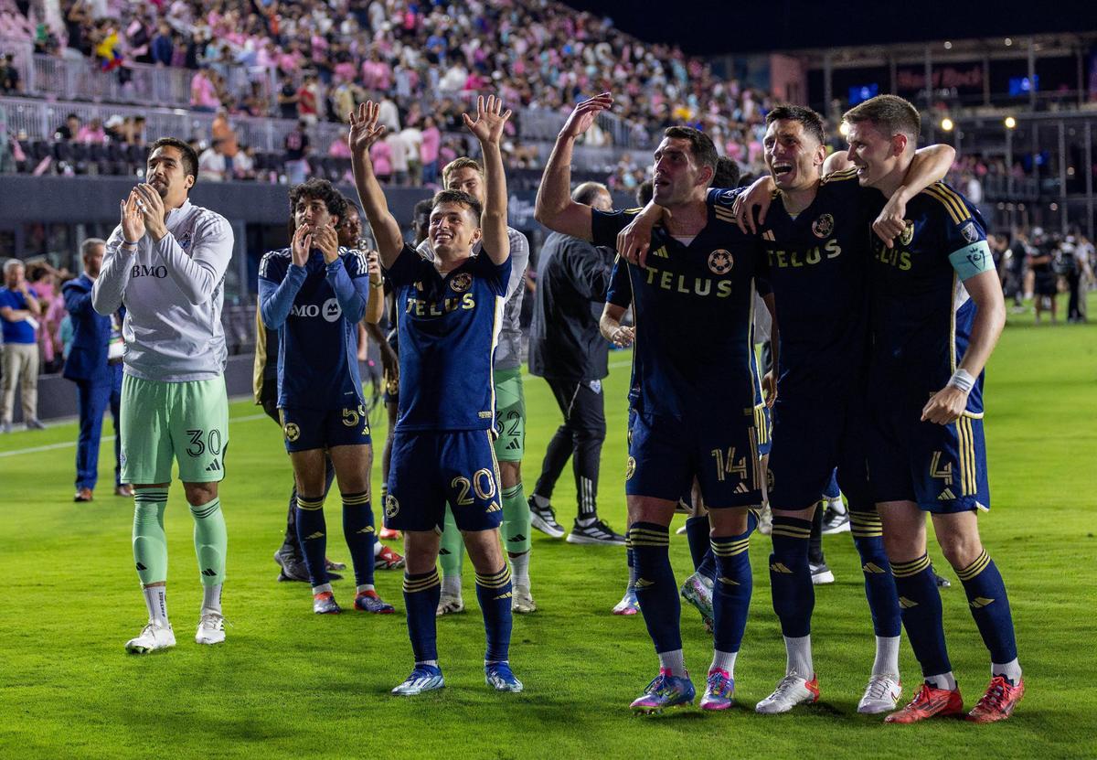 Vancouver Whitecaps goalkeeper Adrián Zendejas (30), midfielder Andrés Cubas (20), forward Daniel Ríos (14), forward Damir Kreilach (19), and defender Ranko Veselinovic (4) celebrate with fans after their 3-1 win over Inter Miami in the Concacaf Champions Cup semifinals at Chase Stadium on Wednesday, April 30, 2025, in Fort Lauderdale, Fla.