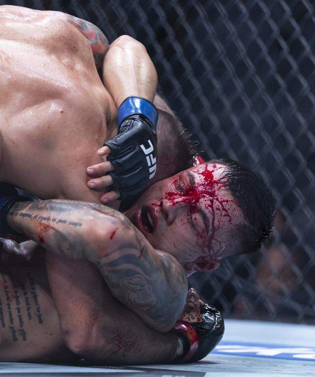 Charles Radtke of the United States and Francisco Prado of Argentina fight in their welterweight bout at UFC 327 at the Kaseya Center on Saturday, April 11, 2026, in downtown Miami, Fla.