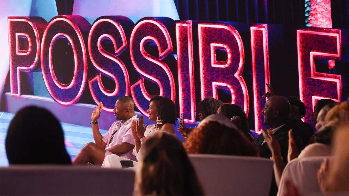 The members of the audience raise their hands when asked about the enjoyment of the content of TV & film producer Issa Rae, the keynote speaker, as she her shares business tips with them at the Possible Conference at the Fontainebleau Hotel on Wednesday, April 29, 2026, in Miami Beach, Florida.