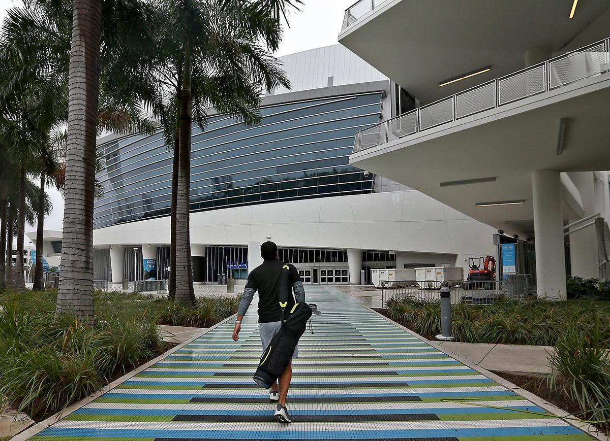 Yassier Sardina of Coral Gables head towards the Stadium Links venue with his clubs to play a round of golf at Marlins Park on Sunday, January 20, 2019.