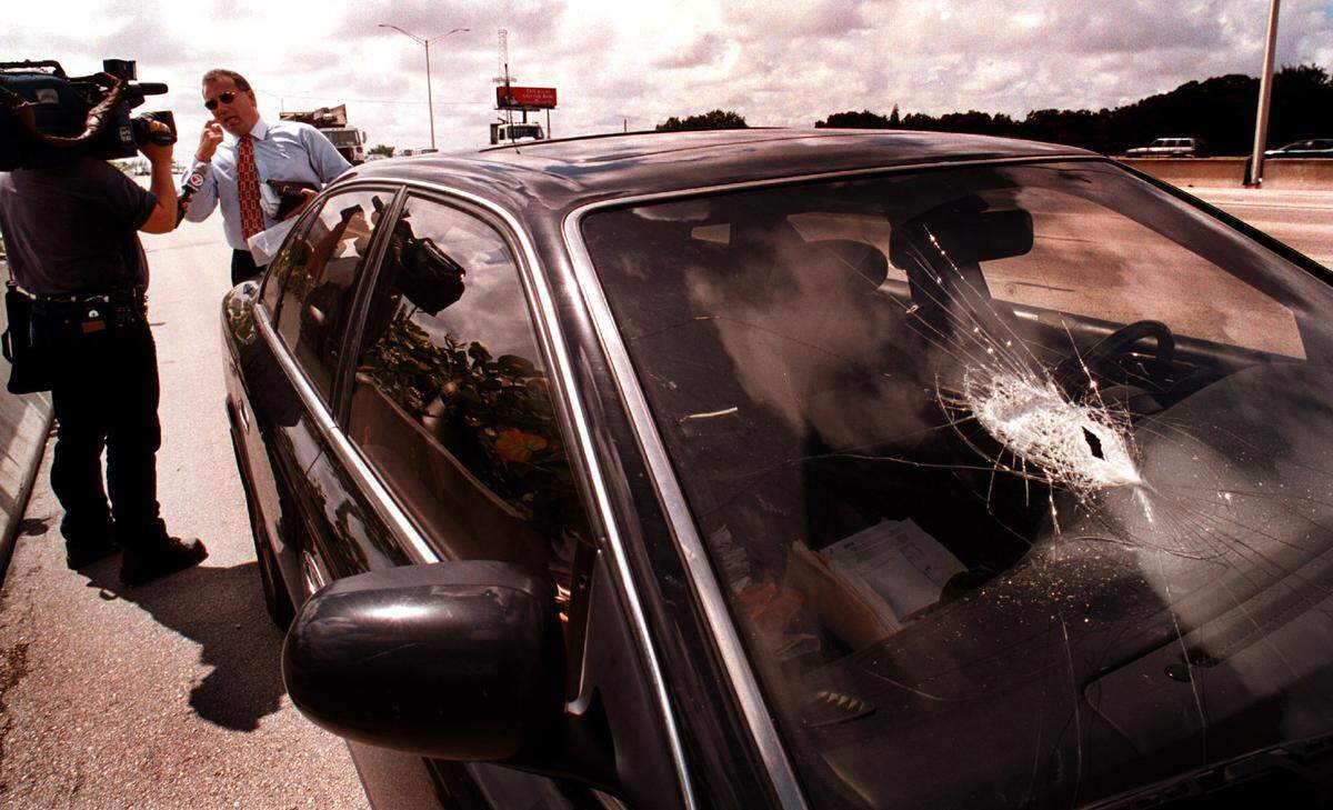 BROWARD 10/08/99....Ed Godoy, explains to Channel 7 photographer, Jesse Fores, about his road debris experience on I95 Friday afternoon. Godoy was heading North bound on I-95 just south of Sheridan Street when something flew up onto the windshield of his Infinity Q45 breaking it and then bouncing off. He says he has no idea what hit the car, but was very scared and glad that no one was in the passenger seat.