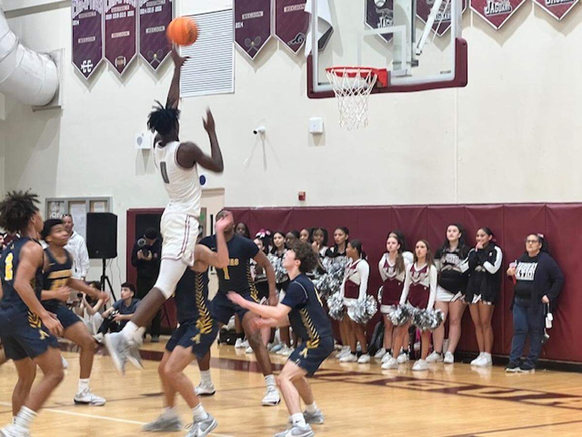 Pembroke Pines Charter senior forward Jeremy Elyzee shoots a floater in the first half against St. Thomas Aquinas in a Class 6A regional final on Friday at Pines Charter.