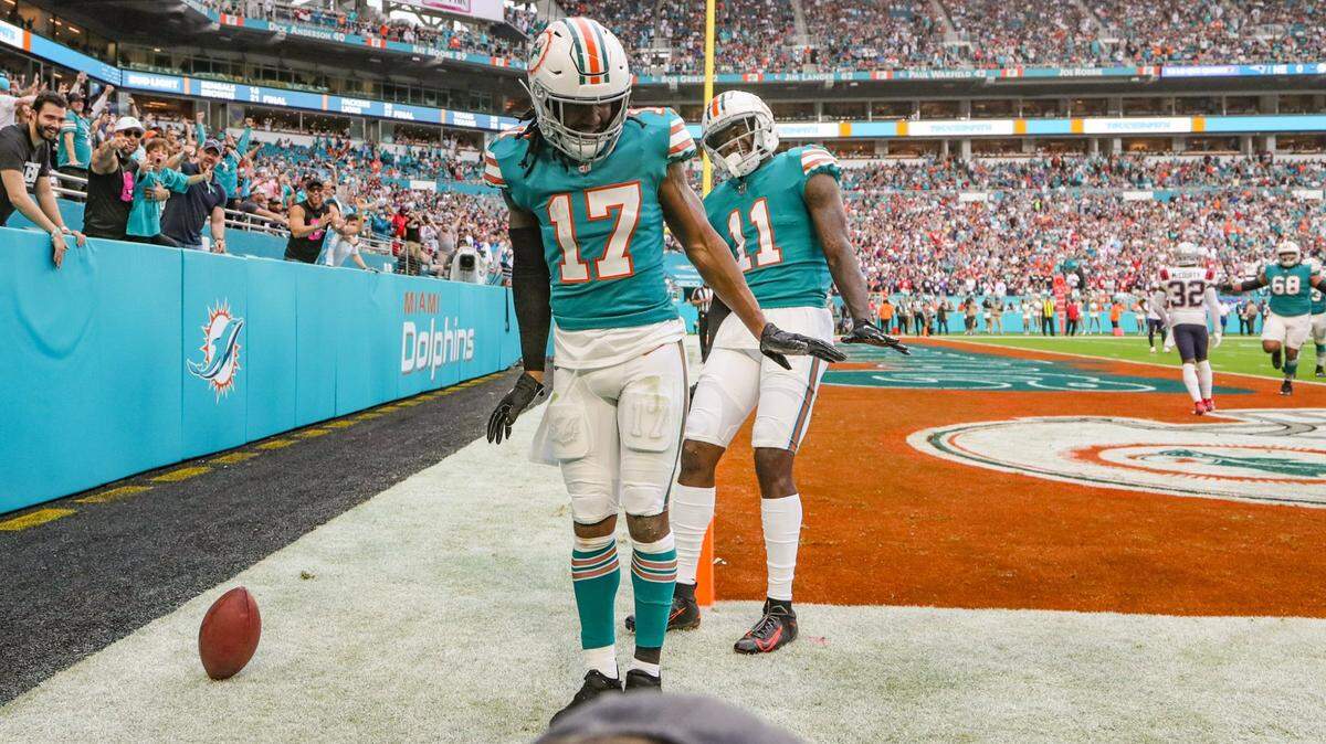 Miami Dolphins wide receiver Jaylen Waddle (17) and wide receiver DeVante Parker (11) do the waddle after Waddle scores in the first quarter against the New England Patriots at Hard Rock Stadium in Miami Gardens on Sunday, January 9, 2022.