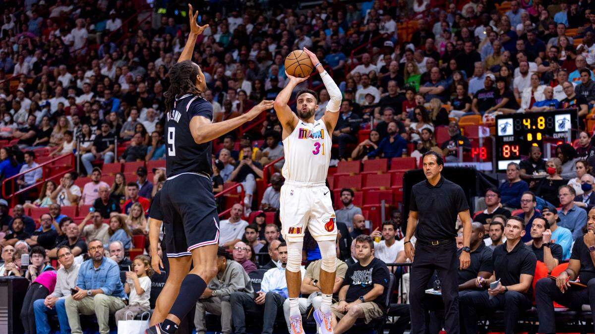 Miami Heat forward Max Strus (31) shoots a three-pointer over Los Angeles Clippers center Moses Brown (9) during the second half of an NBA game at FTX Arena in Downtown Miami, Florida, on Thursday, December 8, 2022.