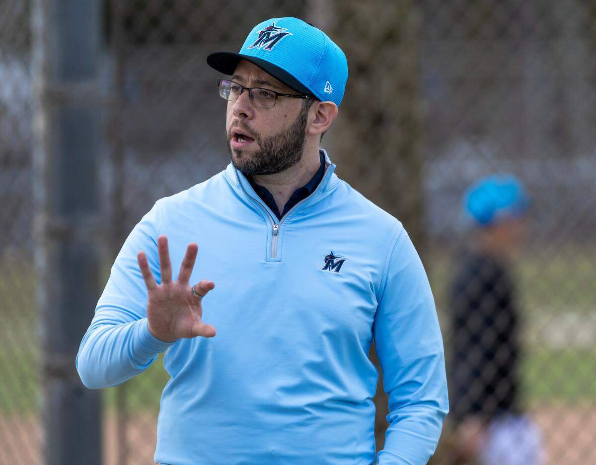 Miami Marlins President of Baseball Operations Peter Bendix looks on during spring training workouts for pitchers and catchers at Roger Dean Stadium in Jupiter, FL, on Wednesday, Feb. 12, 2025.