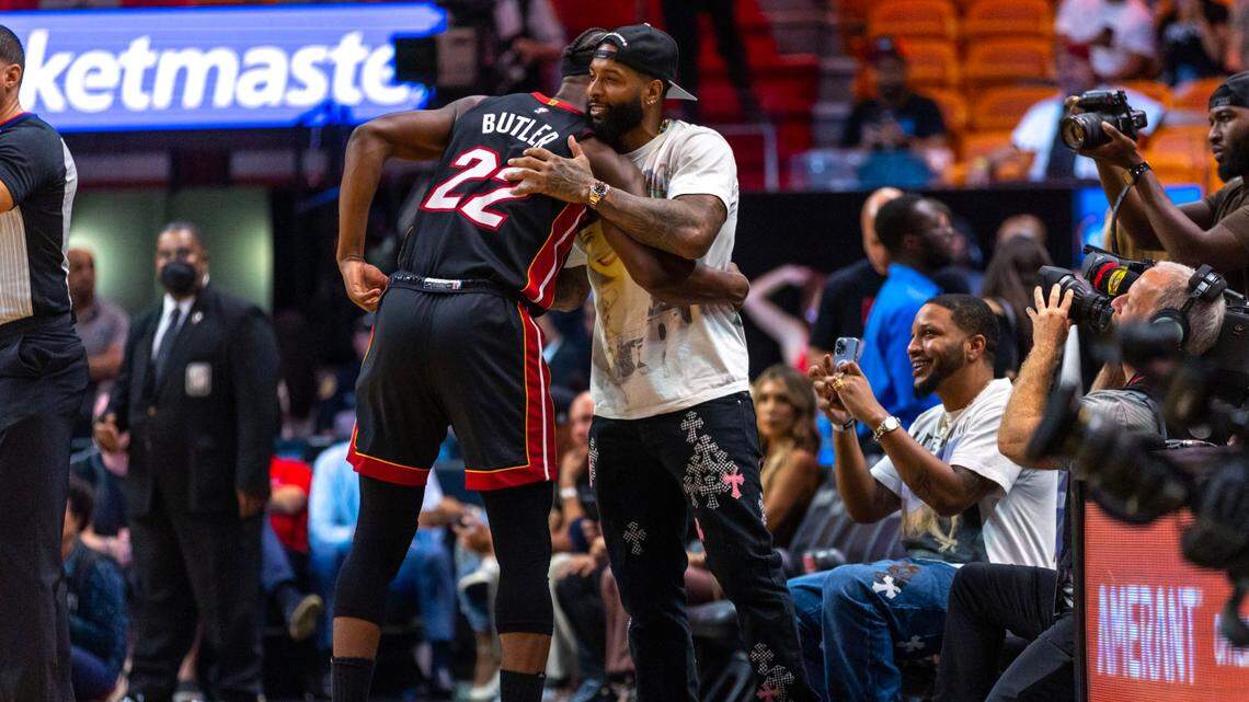 Police escort NFL player Odell Beckham Jr. off a plane at Miami International Airport