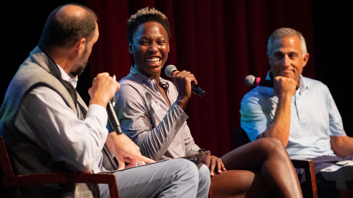 Ashleigh Johnson, Team USA water polo goalkeeper and Ransom alum, center, talks to Ransom Everglades students with Adam Krikorian, her Team USA coach, right, and Eric Lefebvre, water polo coach at Ransom and Johnson’s high school coach, on Tuesday, Dec. 5, 2023, at the school auditorium in Coconut Grove. Team USA has been training at Ransom in preparation for their upcoming matches that week against Spain.