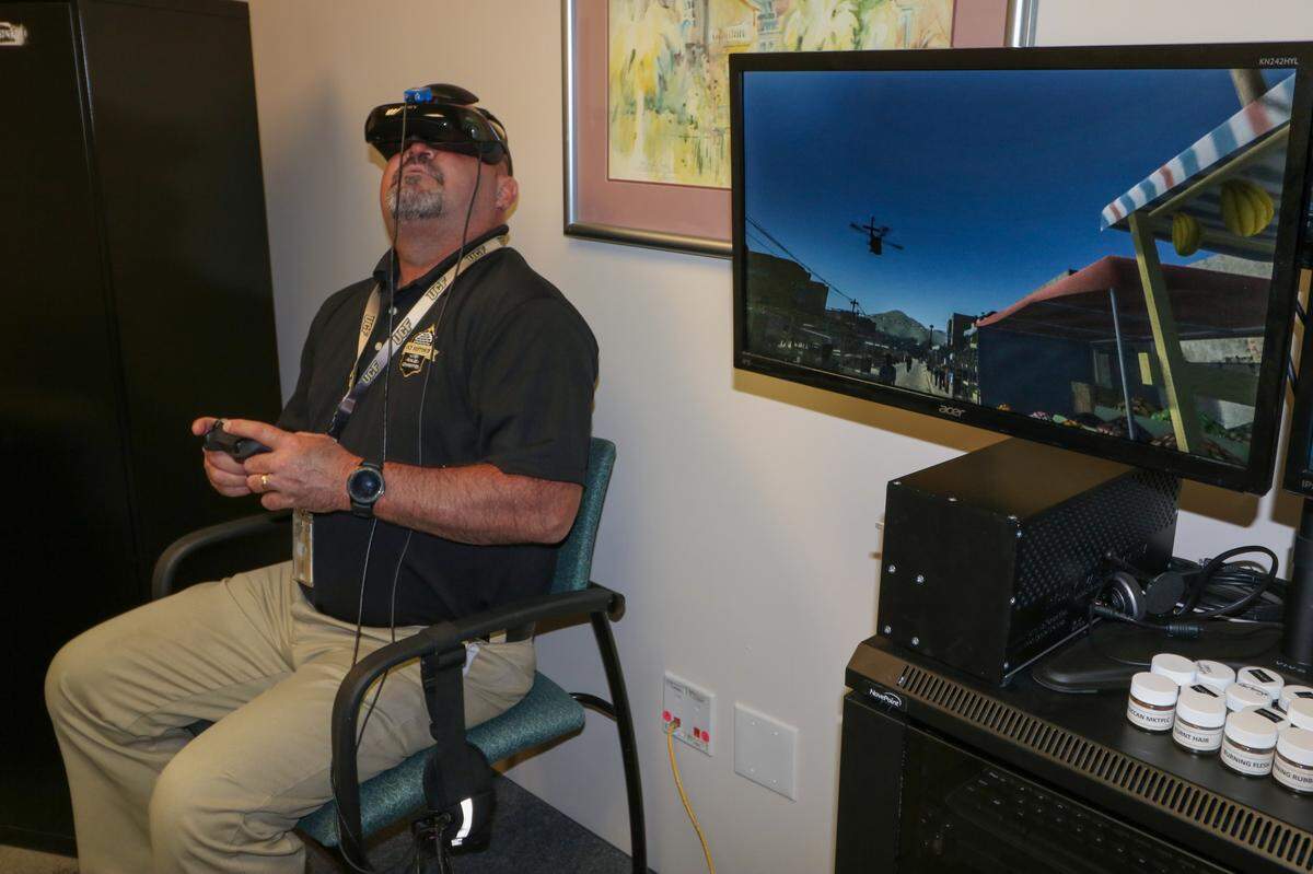A patient participates in virtual realty exposure therapy at UCF RESTORES to help alleviate PTSD symptoms. The facility has treated nearly 250 first responders since 2016.