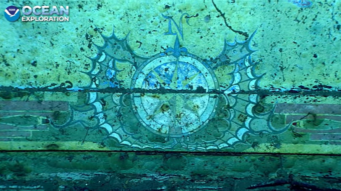 This compass rose was seen at the bottom center of the painting, with seahorses depicted on either side. It’s believed the mural was painted by a member of the crew.