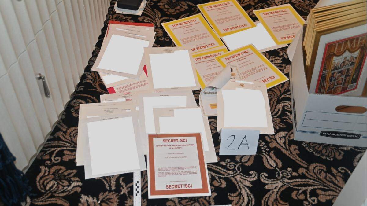 This image of items taken from Mar-a-Lago during the FBI’s Aug. 8 search of the property shows that some of the documents contained cover sheets labeling them “secret” and “top secret.” The picture was included as an attachment in a Department of Justice response on Aug. 30, 2022, to former President Donald Trump’s request to appoint a special master to review seized materials.