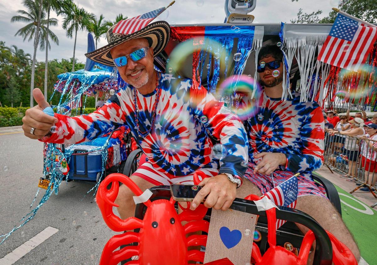 Juan Robbin, a 50 year resident of Key Biscayne, celebrates Independence Day during the 66th Annual Key Biscayne Fourth of July Parade on Key Biscayne, Florida on Friday, July 4, 2025.