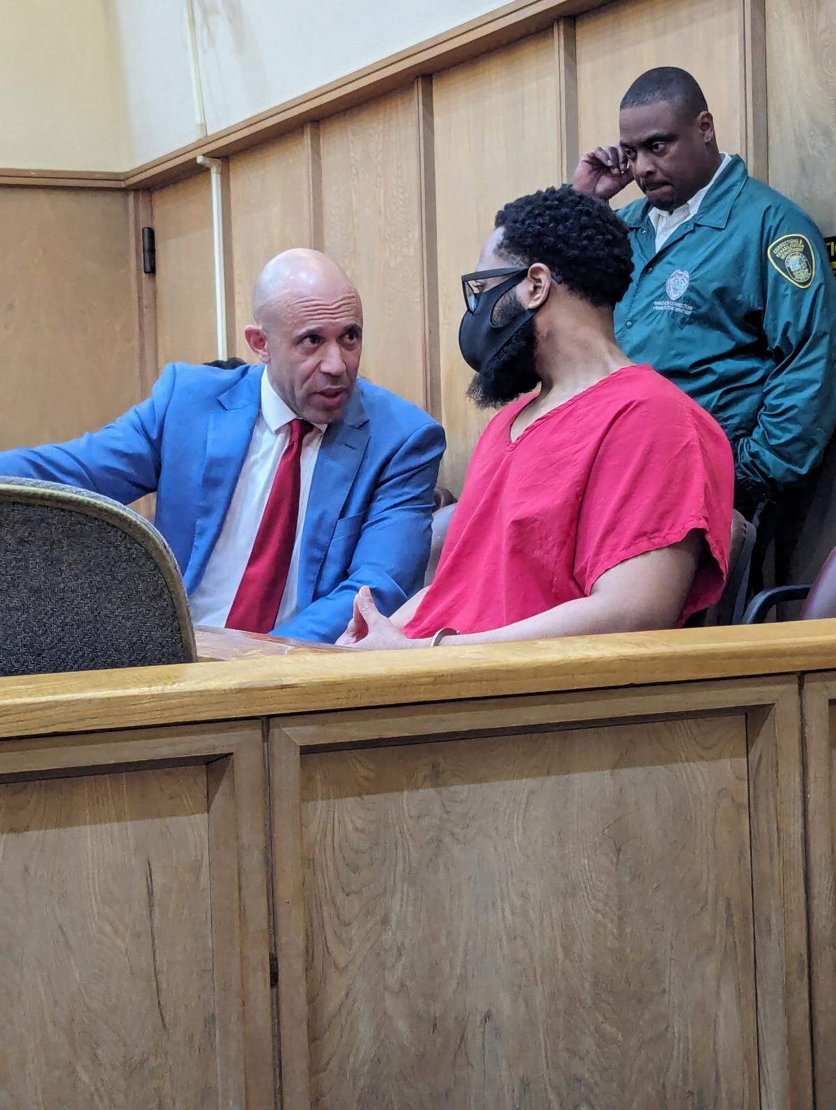 Former Dade Correctional Institution corrections officer Kirk Walton, 36, right, discusses his guilty plea this week in the murder of a prisoner being transferred in 2022, with his attorney Eric Clayman.