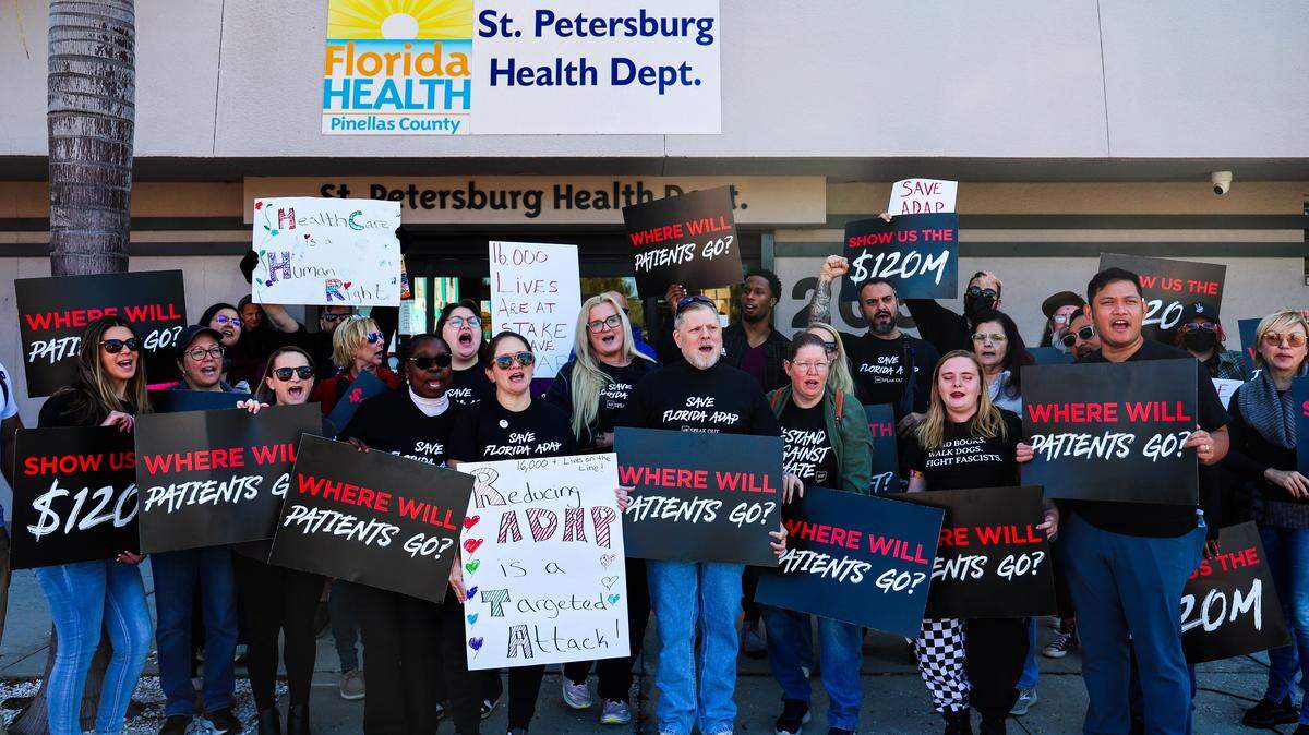 AHF Healthcare Center physicians and employees protest outside the Pinellas County Florida Department of Health office on Jan. 30, 2026 in St. Petersburg. The AIDS Healthcare Foundation held protests demanding the state undo cuts to the AIDS Drug Assistance Program. AHF is also suing the state to try and stop the cuts. 