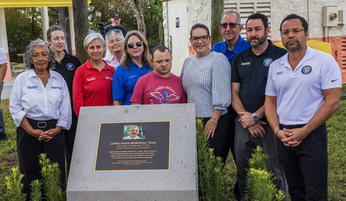 Elected officials, including Hollywood Mayor Josh Levy, right, join Debra Hixon, center left in blue shirt, and her family members at the dedication ceremony for the Chris Hixon Memorial Trail.
