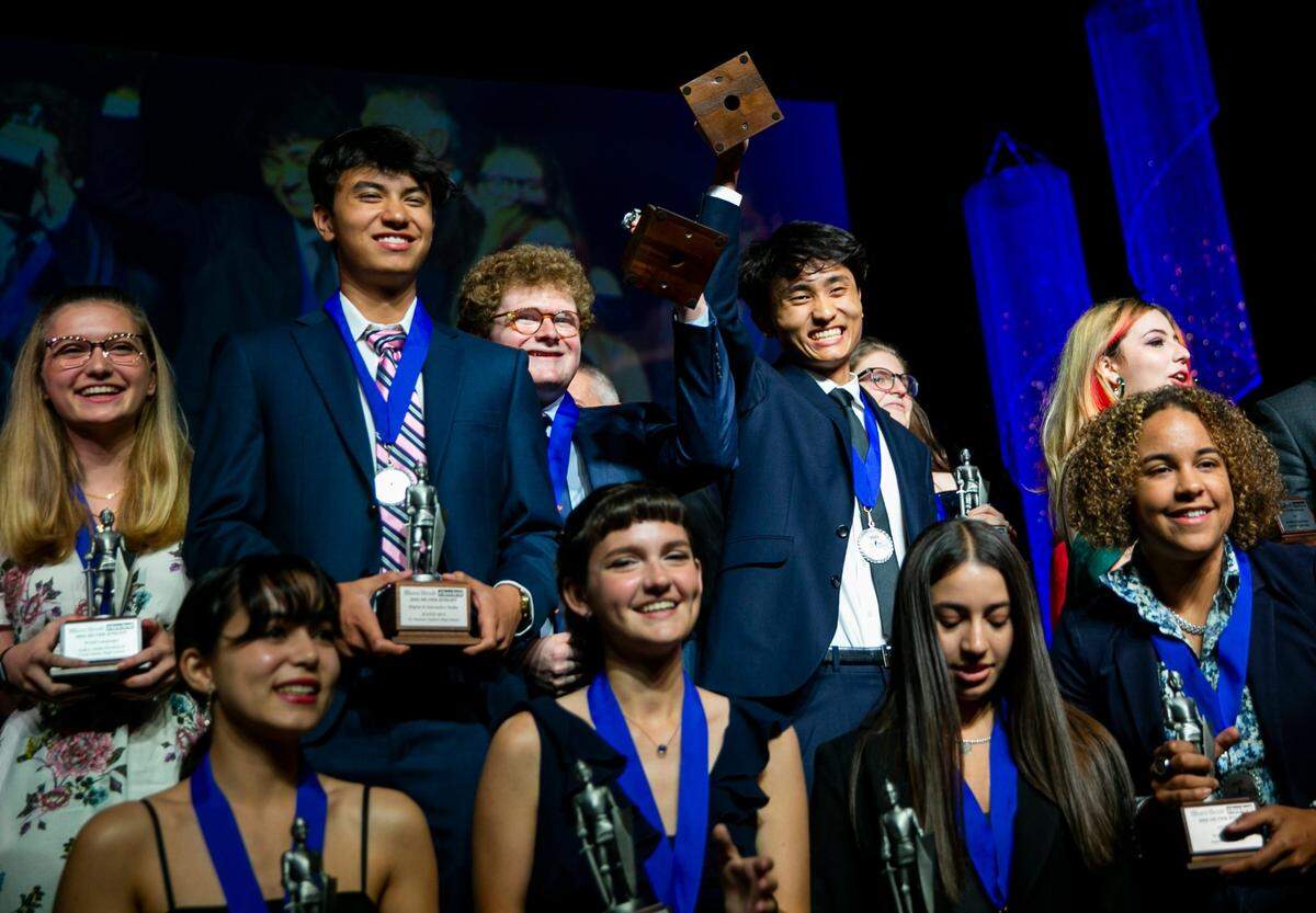 Silver Knight Award winners celebrate on stage after receiving their awards during the Miami Herald & el Nuevo Herald 64th Annual Silver Knight Awards at the James L. Knight Center in downtown Miami, Florida on Thursday, May 26, 2022.
