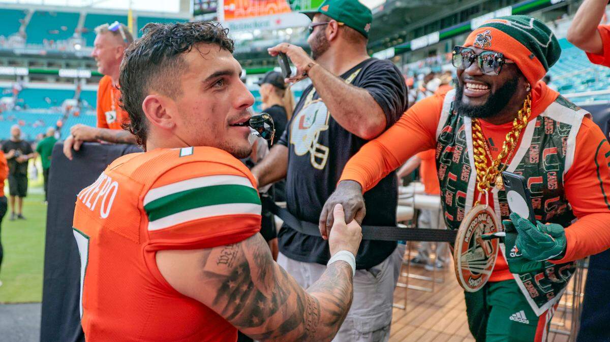 Miami Hurricanes wide receiver Xavier Restrepo (7) celebrates with fans after the Canes defeat Southern Miss Golden Eagles at Hard Rock Stadium in Miami Gardens on Saturday, September 10, 2022.