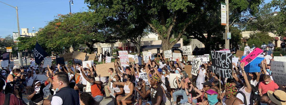 Police brutality protesters after arriving at their last stop, Coral Gables City Hall, and facing the heads of 22 local law enforcement agencies.