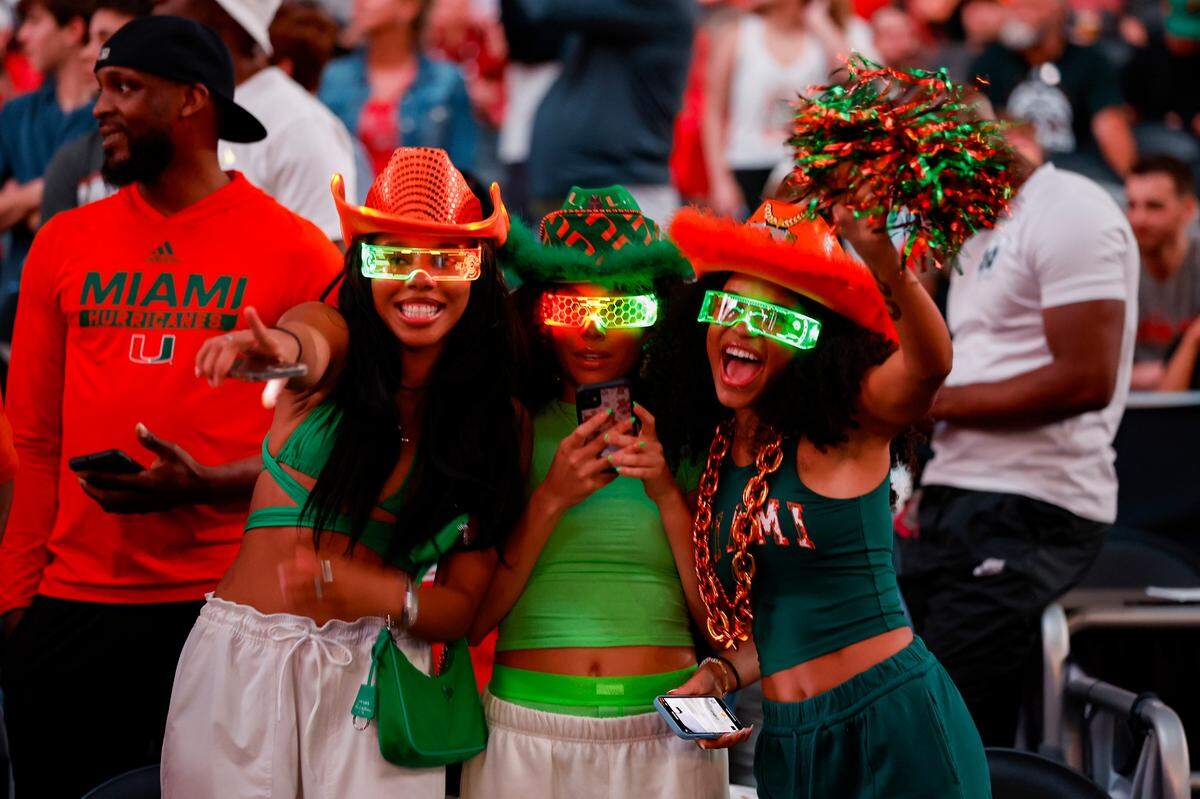 Miami Hurricanes show their support before the start of the Men’s Basketball Championship National Semifinal against the Connecticut Huskies at NRG Stadium in Houston, Texas on Saturday, April 1, 2003.