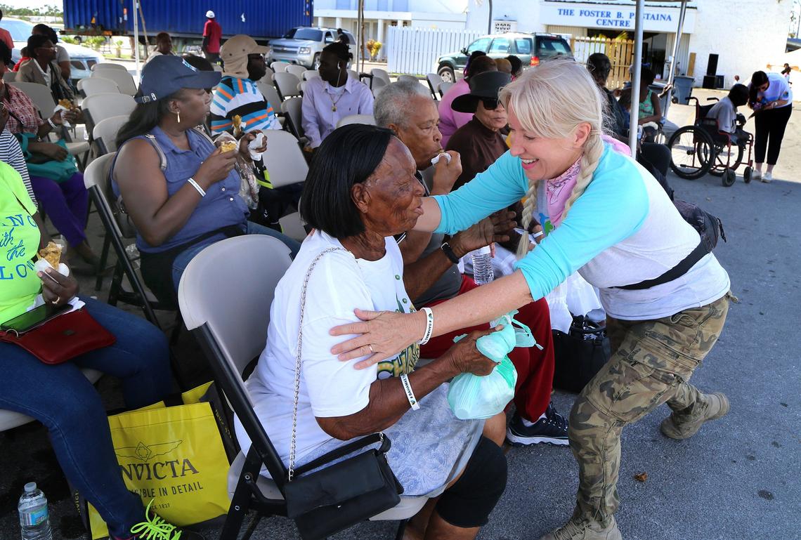 Allison Thompson, founder of Third Wave Volunteers, greets people attending the Bahamas Thanksgiving Relief Lunch at the Christ the King Church in Freeport, Bahamas, on Nov. 23, 2019.
