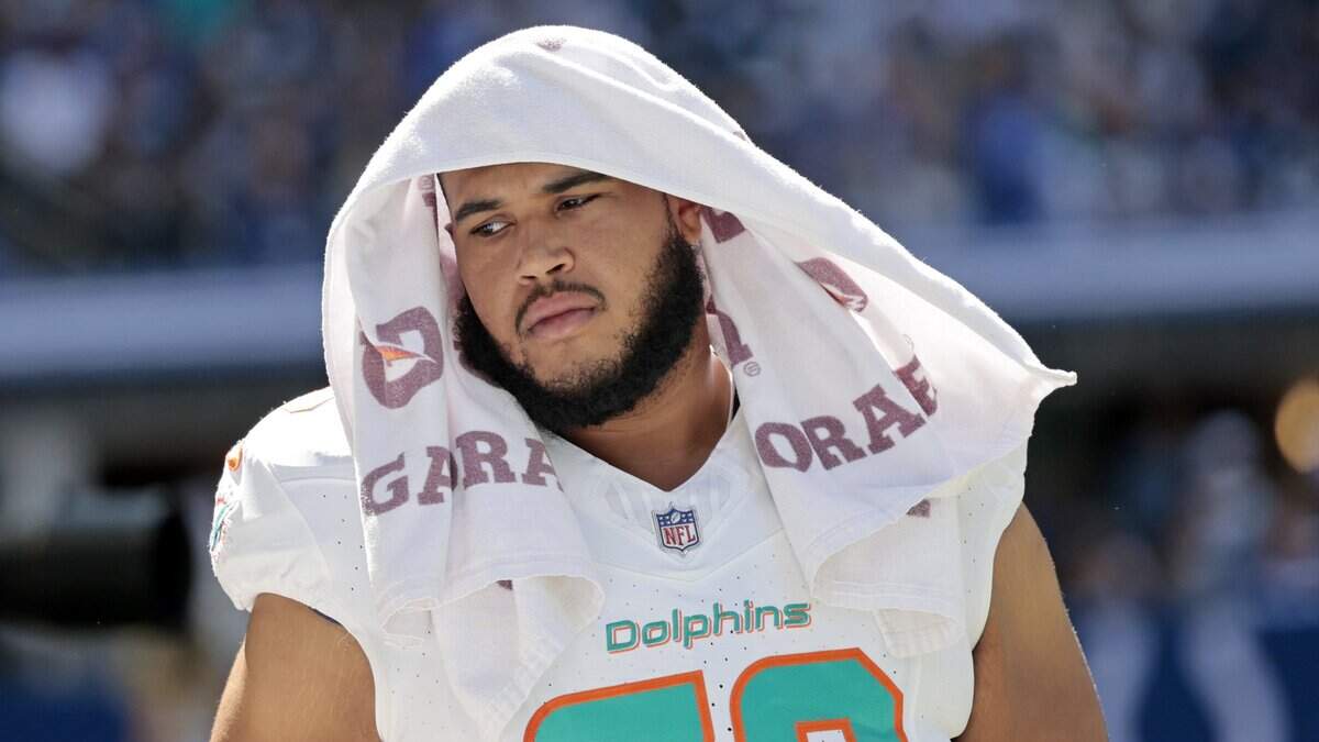 Miami Dolphins offensive tackle Larry Borom (79) reacts late in the fourth quarter during the game against the Indianapolis Colts in the NFL game at Lucas Oil Stadium in Indianapolis on Sunday, September 7, 2025.
