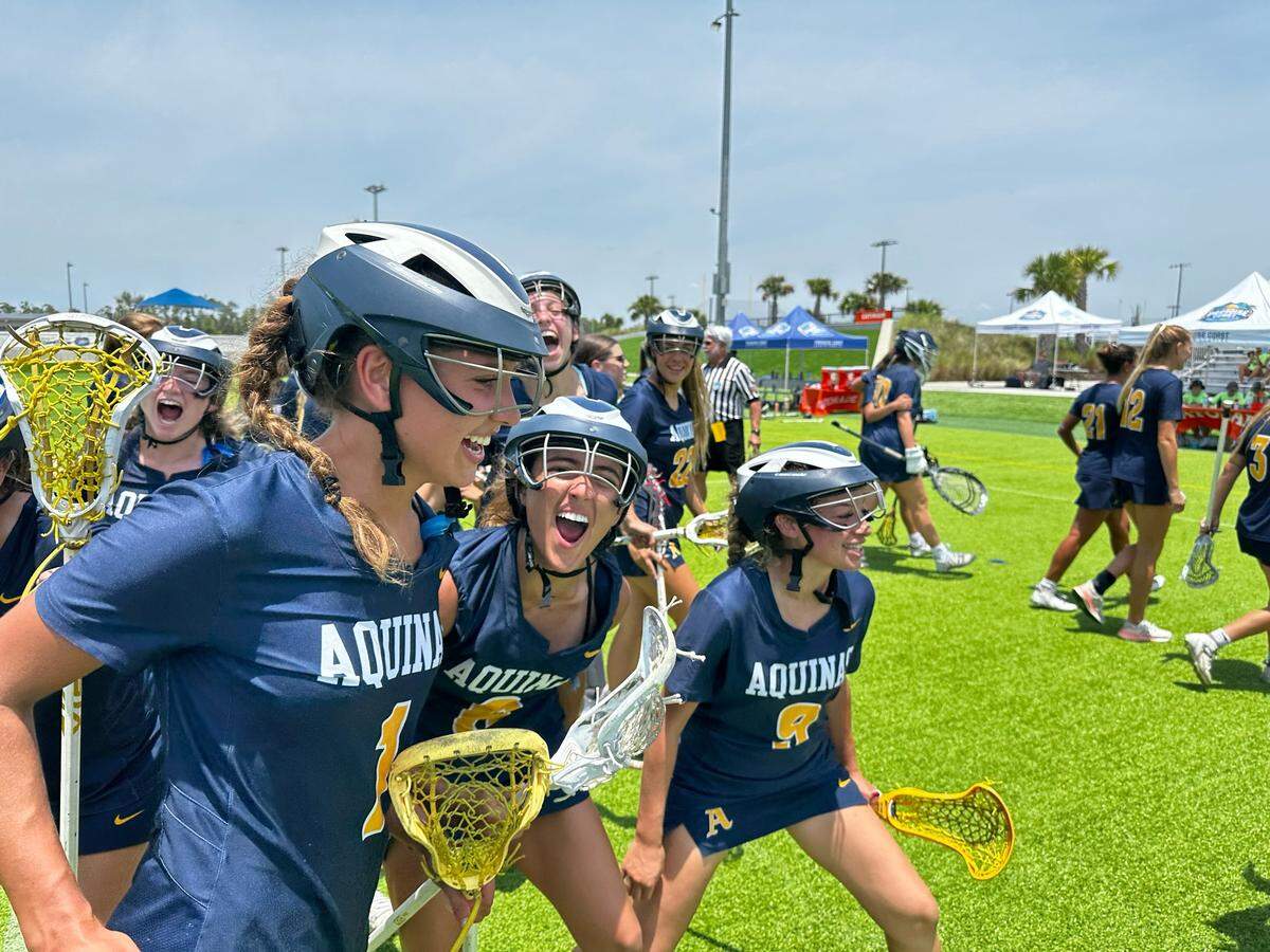 St. Thomas Aquinas’ girls’ lacrosse players celebrate following their 10-8 win over Oviedo Hagerty in the Class 2A state semifinals on Friday afternoon at the Paradise Coast Sports Complex in Naples.