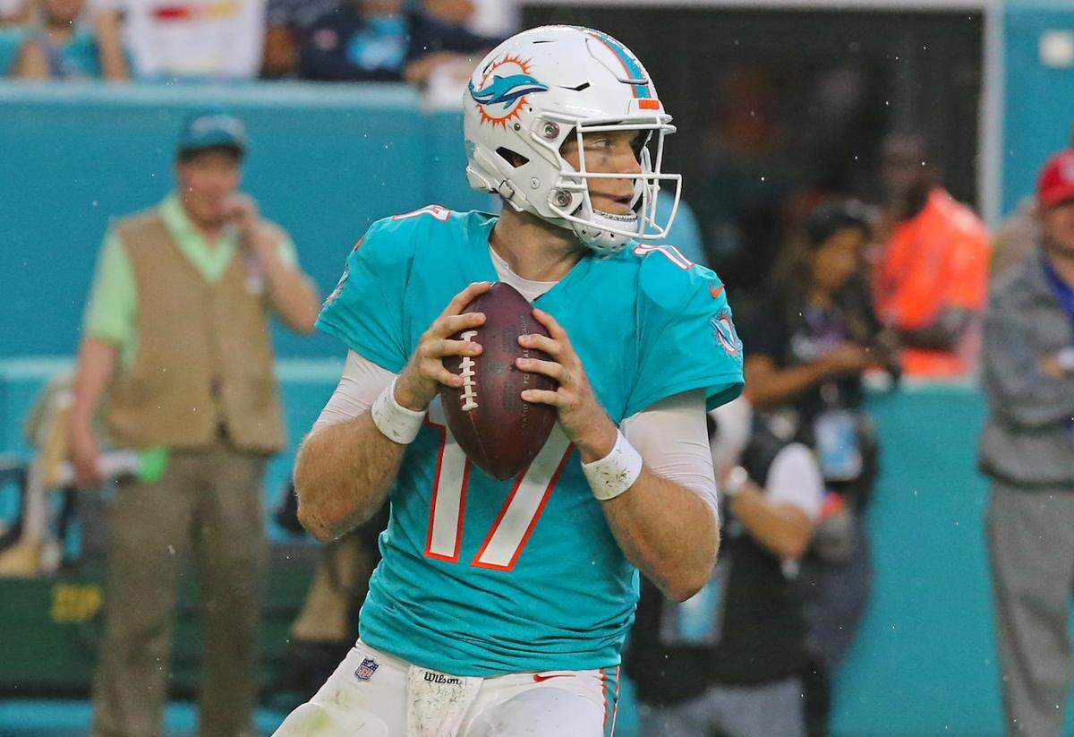 Miami Dolphins quarterback Ryan Tannehill attempt to throws a pass during first quarter of an NFL preseason football game against the Baltimore Ravens at Hard Rock Stadium on Saturday, August 25, 2018, in Miami Gardens.