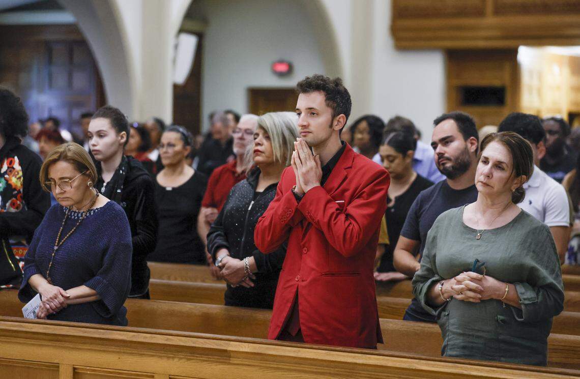 Parishioners listen as Archbishop Thomas Wenski presides over Good Friday of the Lord’s Passion at St. Mary Cathedral, followed by the Stations of the Cross procession, on Friday, April 3, 2026, in Miami.