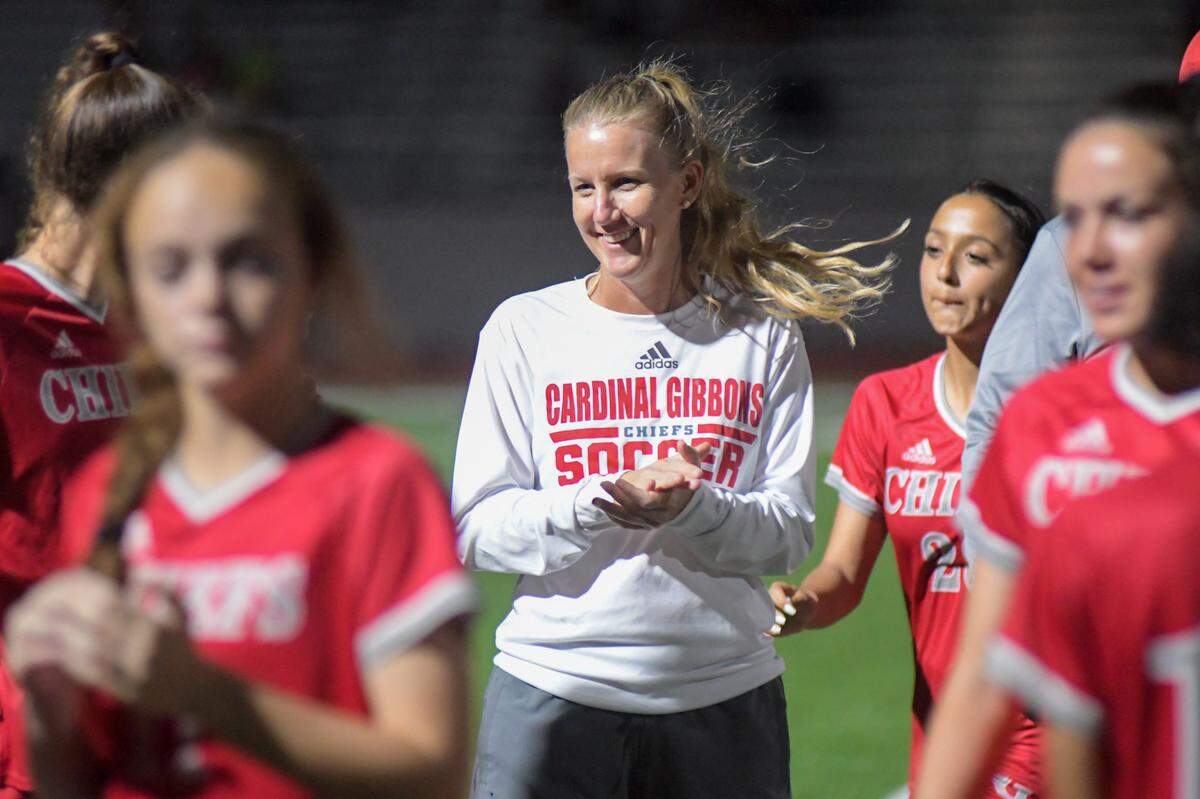 Cardinal Gibbons girls’ soccer coach Margo Flack talks to her team prior to a regional quarterfinal against MAST Academy on Tuesday, Feb. 8, 2021, at Cardinal Gibbons High School in Fort Lauderdale, Florida.