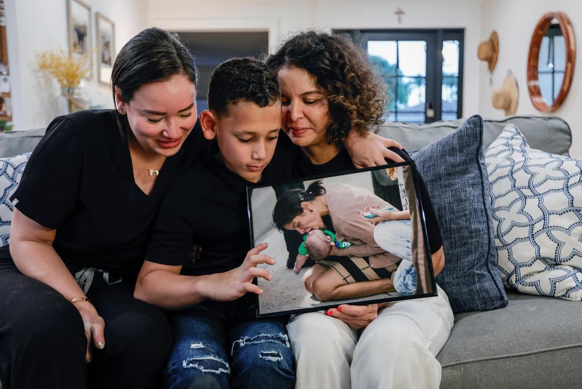 Paola Vargas, the mom of Sebastian de la Cruz,10, and his aunt Pamela Rauseo, left to right, embraceon Monday, Feb. 12, 2024.