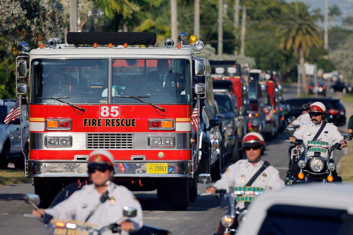 The funeral procession for Broward Sheriff Fire Rescue Battalion Chief Terryson Jackson leaves the L.C. Poitier Funeral Home in Pompano Beach on Friday, Sept. 8, 2023. Jackson died in a helicopter crash on Monday, Aug. 28, when he and two BSFR colleagues were returning to the airport after responding to an emergency call. (Amy Beth Bennett / South Florida Sun Sentinel)