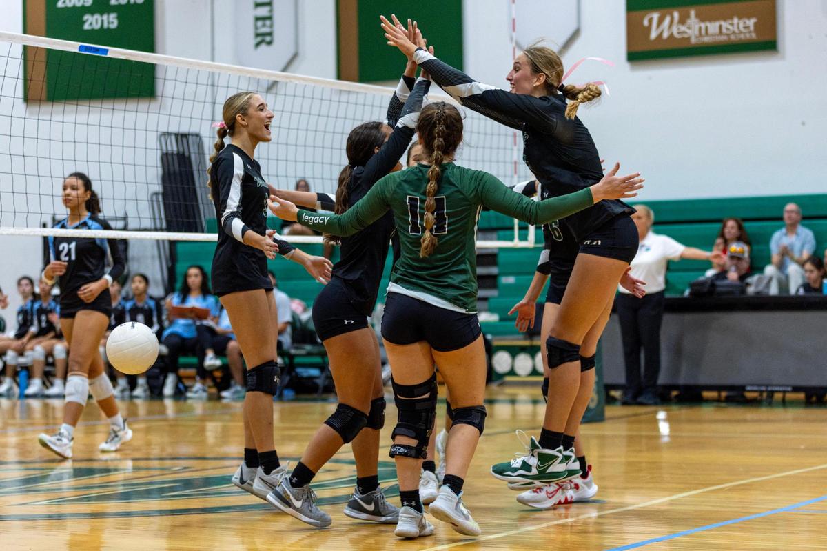 Westminster Christian girl’s volleyball team celebrates after defeating Ransom Everglades during the girls volleyball regional championship game at Westminster Christian School in Miami, Florida, on Tuesday, October 31, 2023.