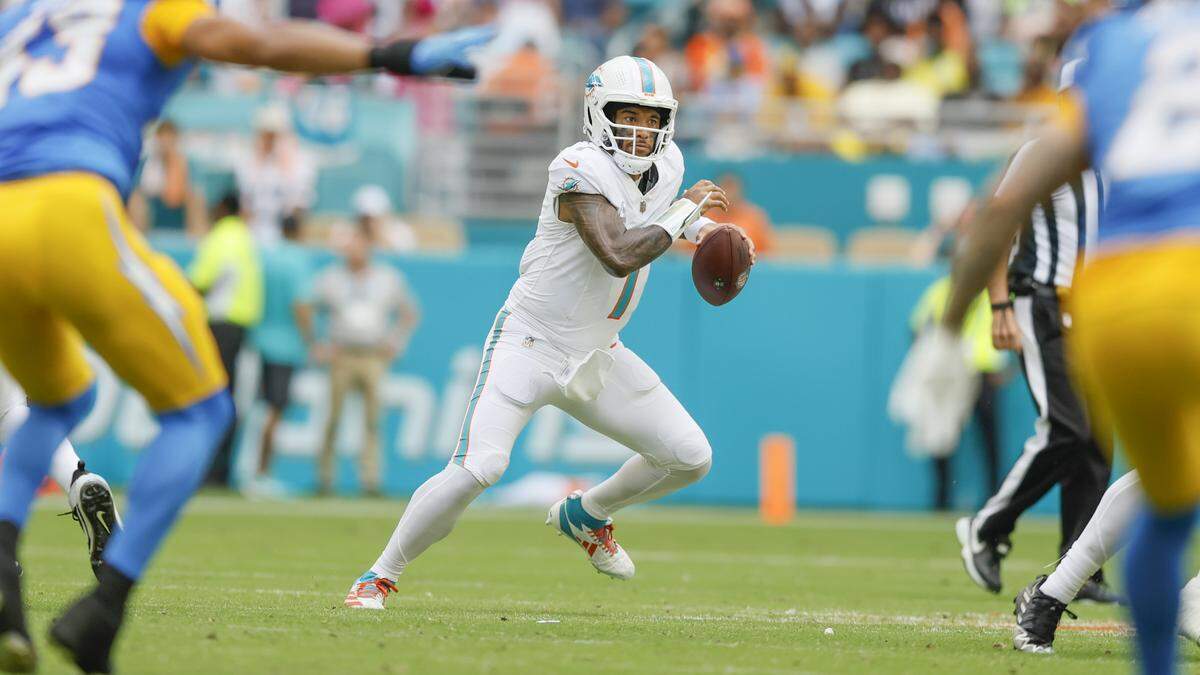 Miami Dolphins quarterback Tua Tagovailoa (1) scrambles in the first half of their NFL football game against the Los Angeles Chargers at Hard Rock Stadium in Miami Gardens, FL, on Sunday, October 12, 2025.