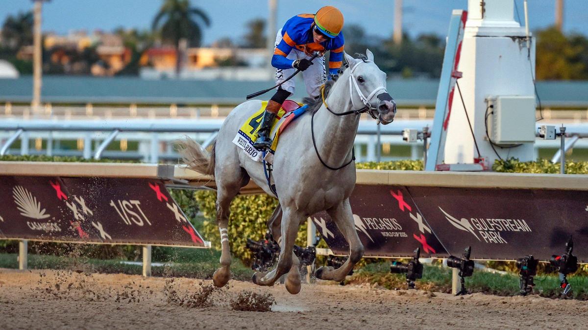Jockey Irad Ortiz Jr. crosses the finish line riding White Abarrio to win the Pegasus World Cup Invitational at Gulfstream Park in Hallandale Beach on Saturday.