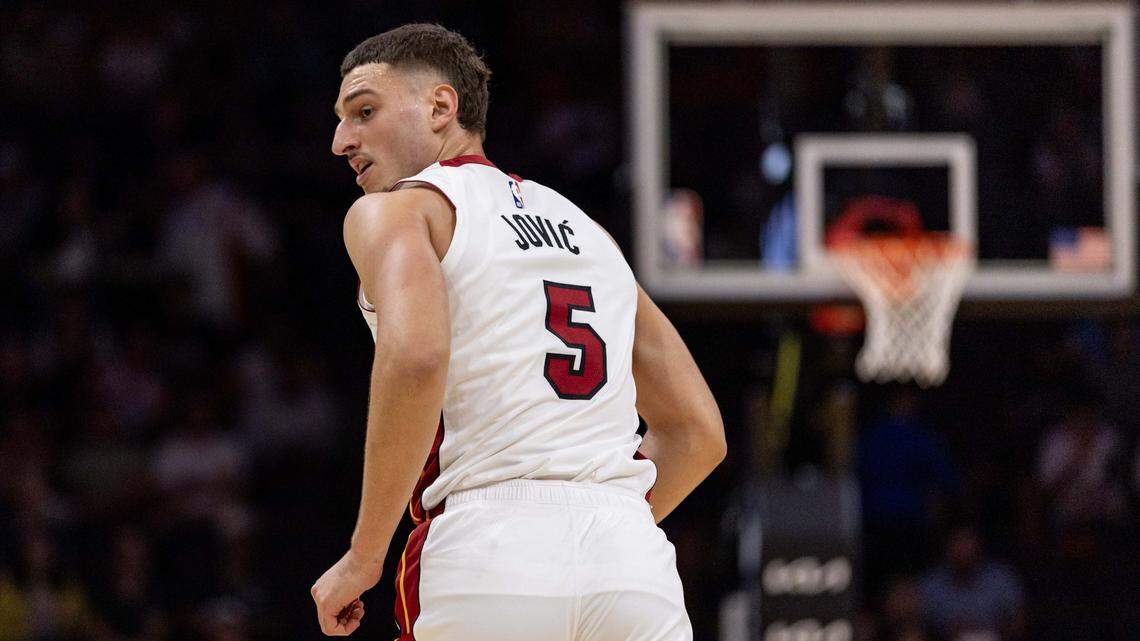 Miami Heat forward Nikola Jovic (5) reacts to hitting a shot during an NBA preseason game against the San Antonio Spurs at Kaseya Center on October 8, 2025, in Miami.