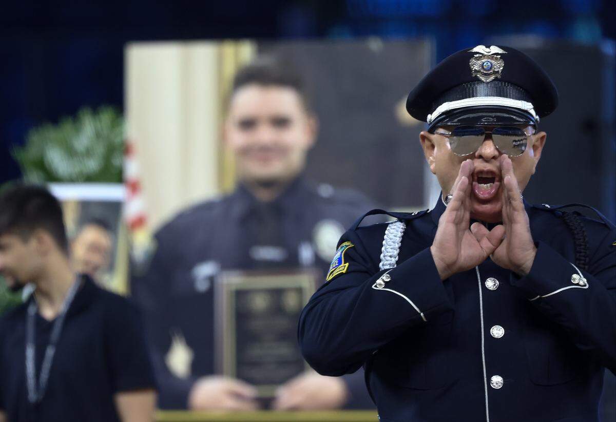 Formation instructions are ordered as multi-agency Color Guards present Colors in a short rehearsal for the funeral service for Miami-Dade Sheriff’s Office Deputy Devin Jaramillo at Loan Deport Park, Tuesday, Nov. 18, 2025, in Miami, Florida.