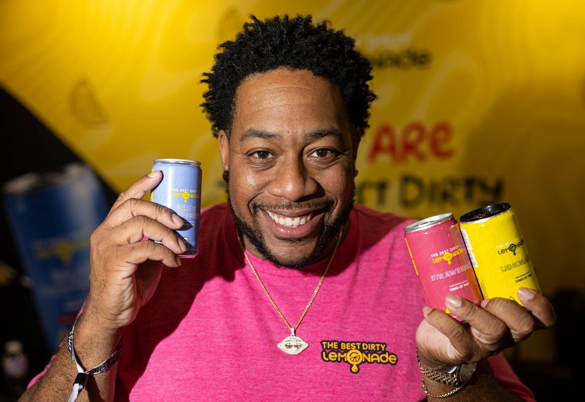 Omari Anderson, CEO of The Best Dirty Lemonade, holds some of his company’s products while attending the CHAMPS Trade Show at the Broward County Convention Center on Thursday, Oct. 17, 2024, in Fort Lauderdale, Fla.