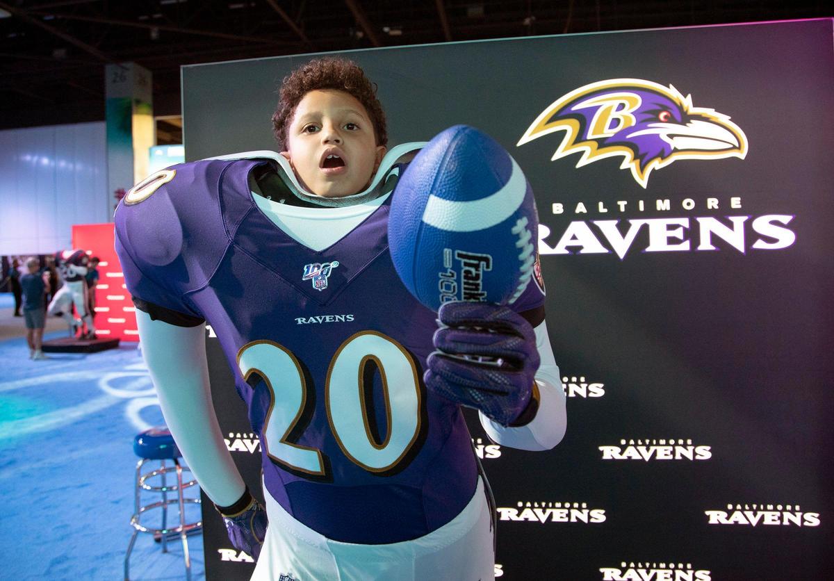 Bernardo Duarte, 8, poses for a photo during the Super Bowl Experience in the Miami Beach Convention Center on Miami Beach, Saturday, January 25, 2020.