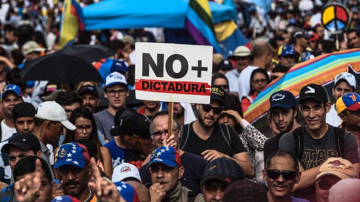 Venezuelan opposition activists in Caracas protest against President Maduro’s government in 2017.