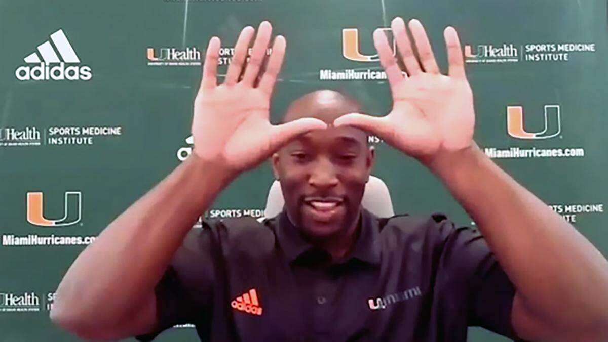 Miami Hurricanes outside linebackers coach Ishmael Aristide is shown throwing up the U during his first Zoom meeting with the media March 4, 2021.