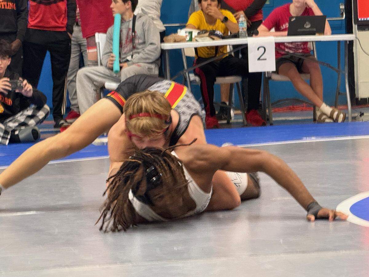 Ivan Kyryianenk of South Broward (top) wins the BCAA title at 138 pounds on Saturday at Dillard High School in Fort Lauderdale.