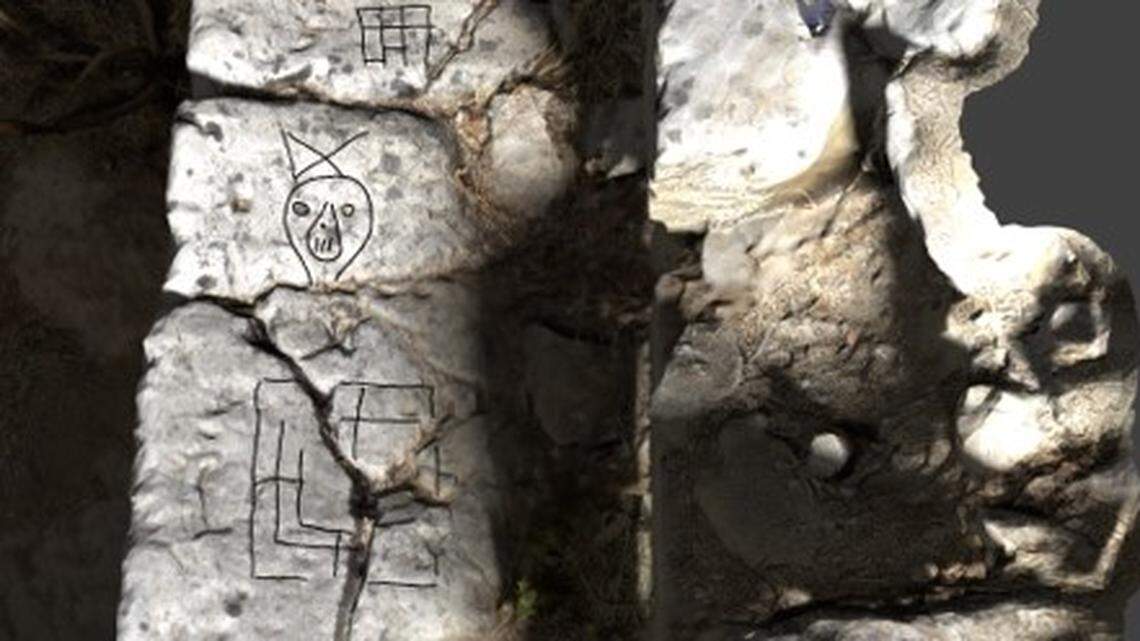 Lines and drawings on ancient prison walls were likely art and a game board, researchers said.